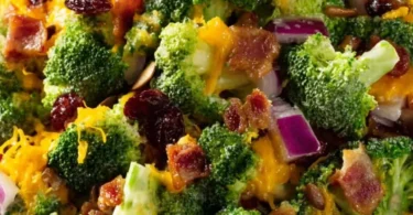 Bowl of Amish Broccoli Cheddar Salad with fresh broccoli and cheddar cheese