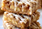 Delicious homemade apple bars topped with cinnamon and a buttery crust