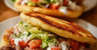 Plate of authentic Mexican gorditas filled with savory ingredients
