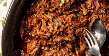 Delicious Beef Barbacoa served in a taco with fresh toppings