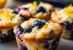Blueberry and lemon zest cottage cheese bites on a white plate