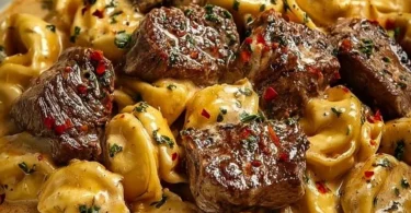 Delicious Garlic Steak Tortellini served with creamy sauce on a plate