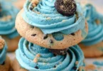 Delicious Crumbl Blue Monster Cookie on a plate with colorful toppings