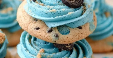 Delicious Crumbl Blue Monster Cookie on a plate with colorful toppings
