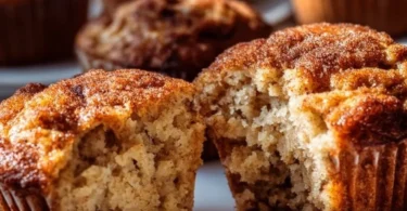 Fluffy banana cinnamon Greek yogurt muffins on a wooden table
