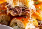 Delicious French Dip Sliders served with au jus for dipping