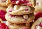 Gooey raspberry white chocolate cookies with fresh raspberries and melted chocolate