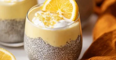 Bowl of Lemon Cream Chia Pudding made with oat milk, topped with lemon zest.
