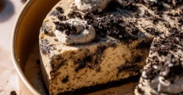 Delicious Oreo Cookie Cake with creamy frosting and crushed Oreos on top