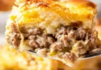Delicious White Castle casserole served on a plate with toppings
