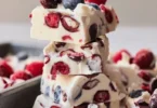 Homemade yogurt bark topped with fresh fruits and nuts